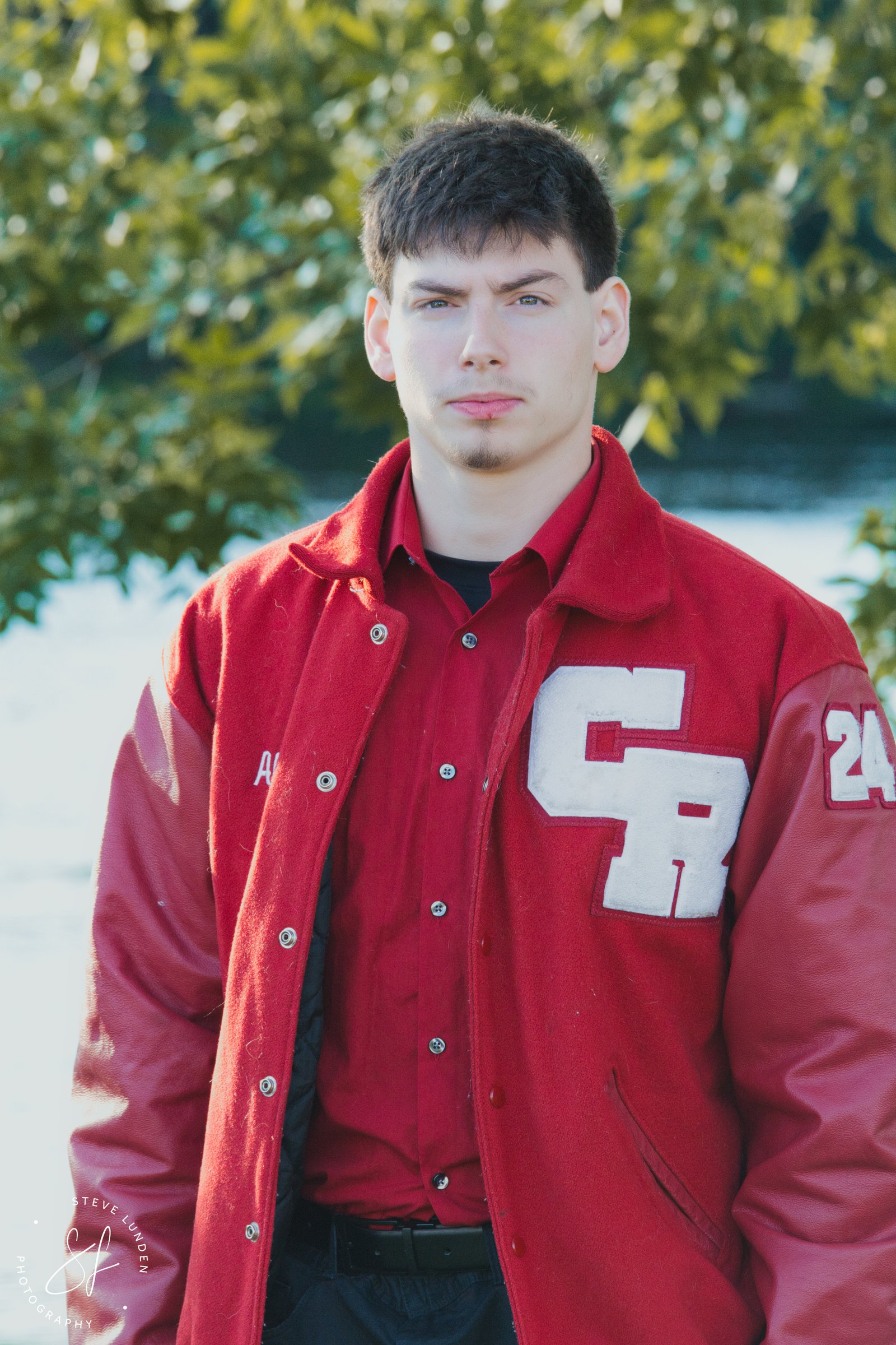 Senior photos in Anoka MN along the Rum River riverfront at golden hour